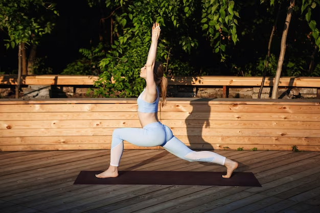 Girl doing yoga on the mat