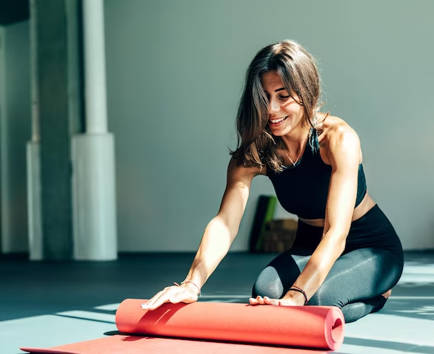 Girl doing yoga using a mat